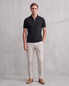 Modern Men's Zip-Up Polo Shirt - Stylish & Breathable Design on model - Black